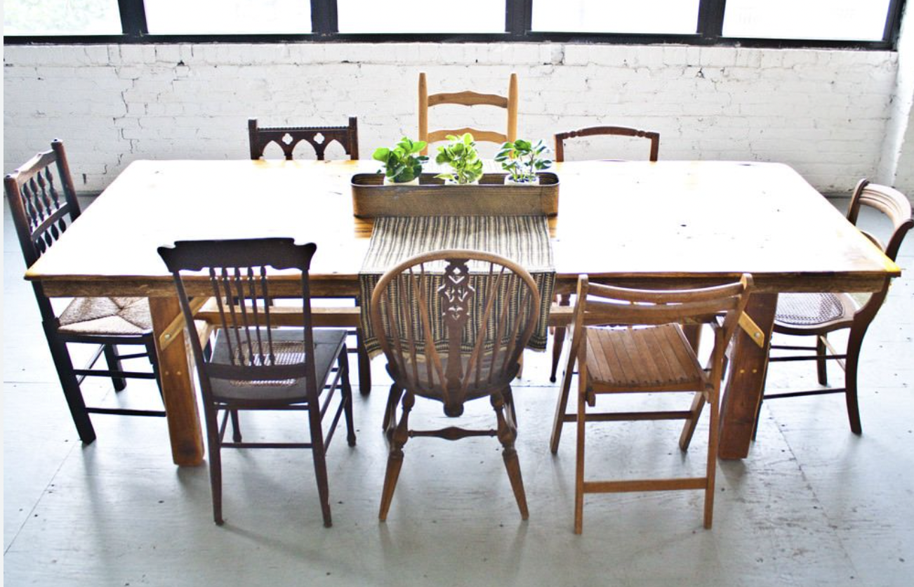An empty table with waiting chairs — a seat for you